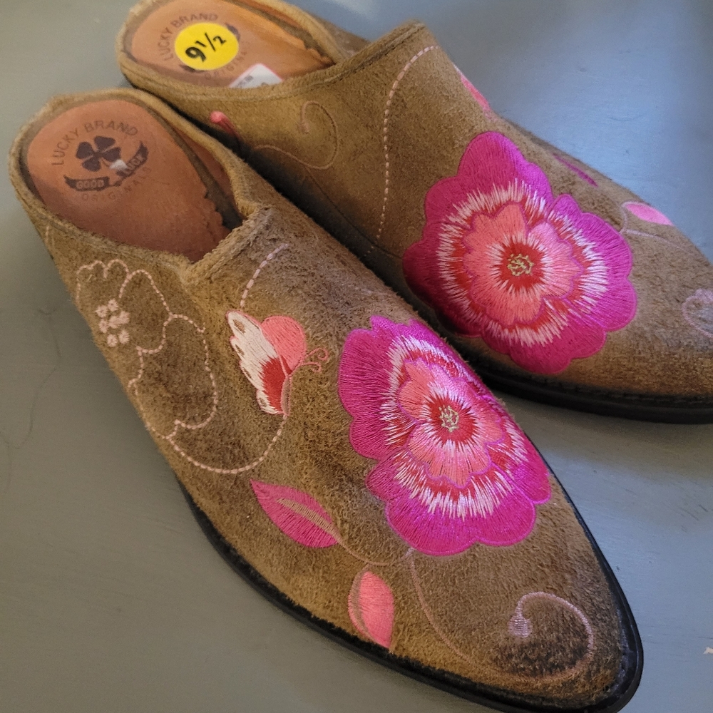 Beautiful suede embroidered slides with metal toe plate.